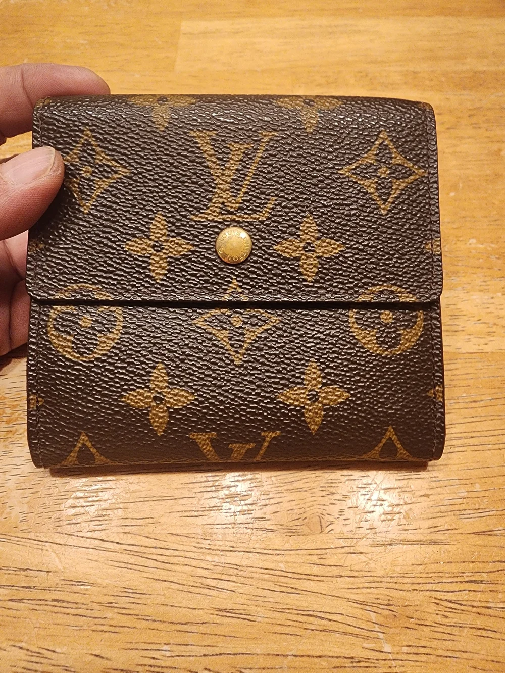 vintage Louis Vuitton Monogram Elise Wallet crafted in the classic brown LV